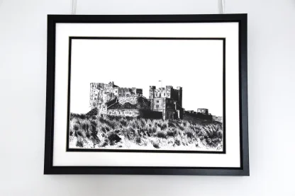"framed Black and white pen drawing showing castle on sandewns"